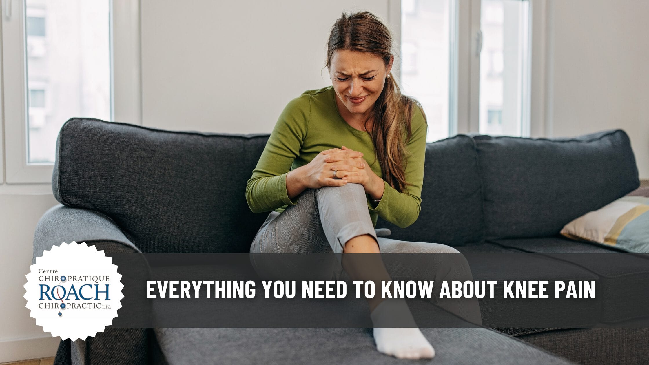a woman on the couch experiencing knee pain and holding her knee with both hands