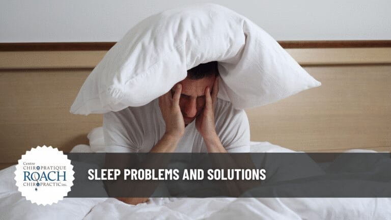 a man awake in bed with a pillow on his head having trouble sleeping