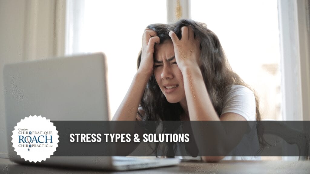 a person sitting at a computer with hands on head dealing with stress