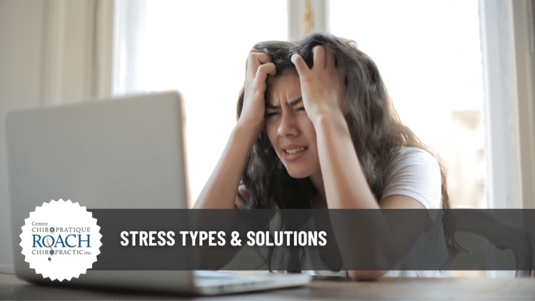 a person sitting at a computer with hands on head dealing with stress