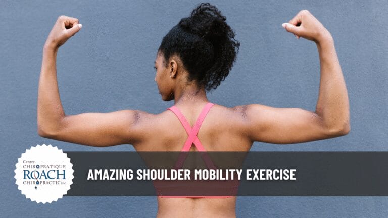 woman posing to display a chiropractic wall angle shoulder exercise.