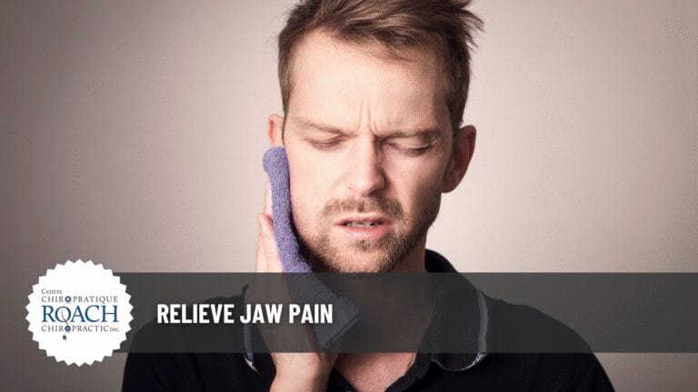 a man holding a cloth to his face, experiencing jaw pain.