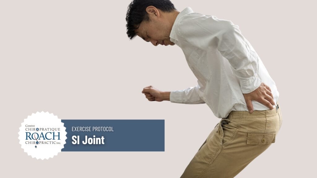 a man experiencing pain with his hand on his SI Joint