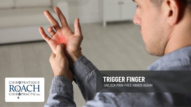 a man holding his hand indicating the pain point of trigger finger