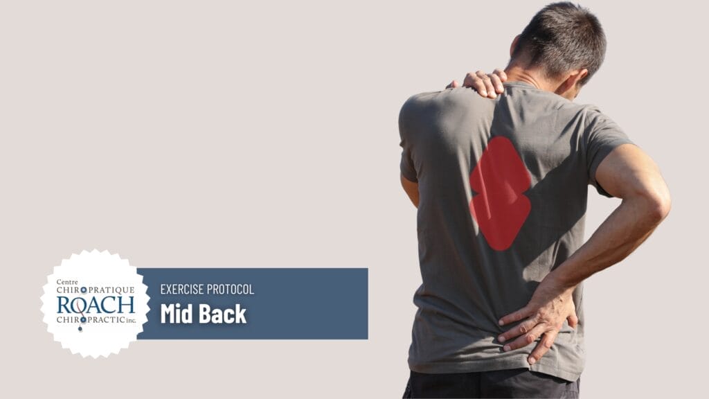 a man holding his mid back in pain