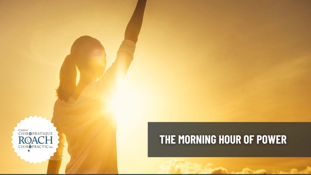 a woman starting her morning off with a readiness for the day, holding her arm up to the sunlight