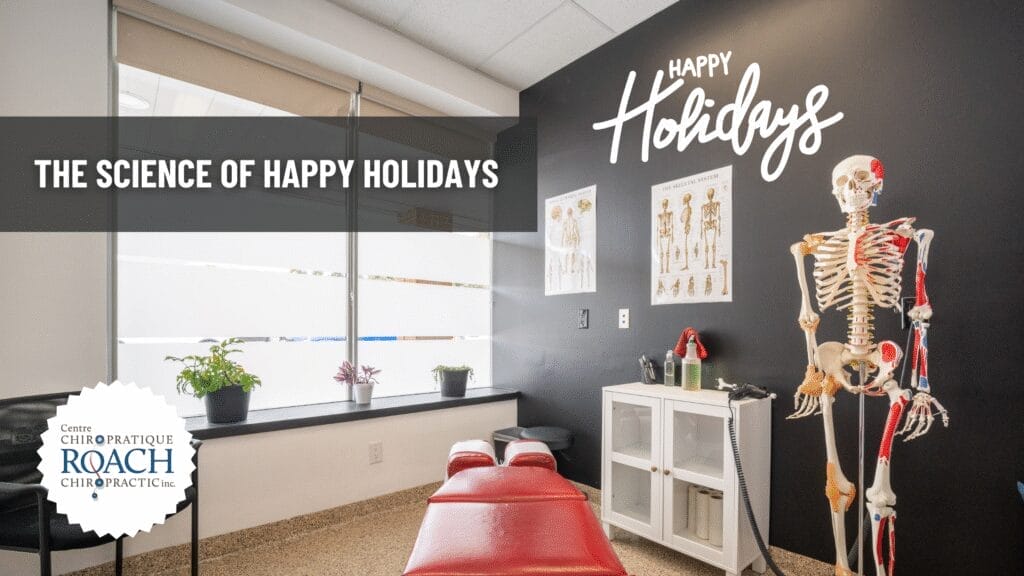 a chiropractic room with happy holidays written on the wall