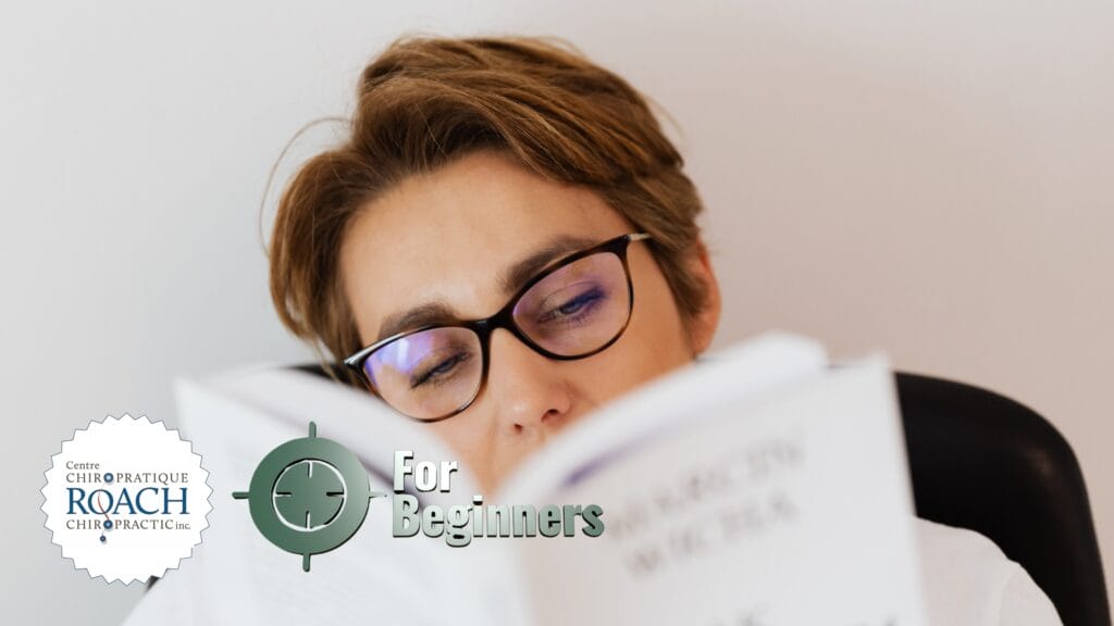 a person reading a beginners guide to creating lasting chiropractic habits