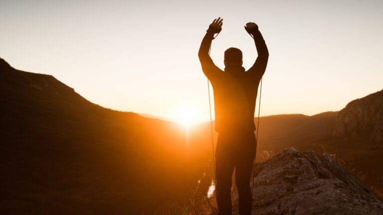 a person exercising while out for a run, keeping motivated with tips learned through chiropractic care.